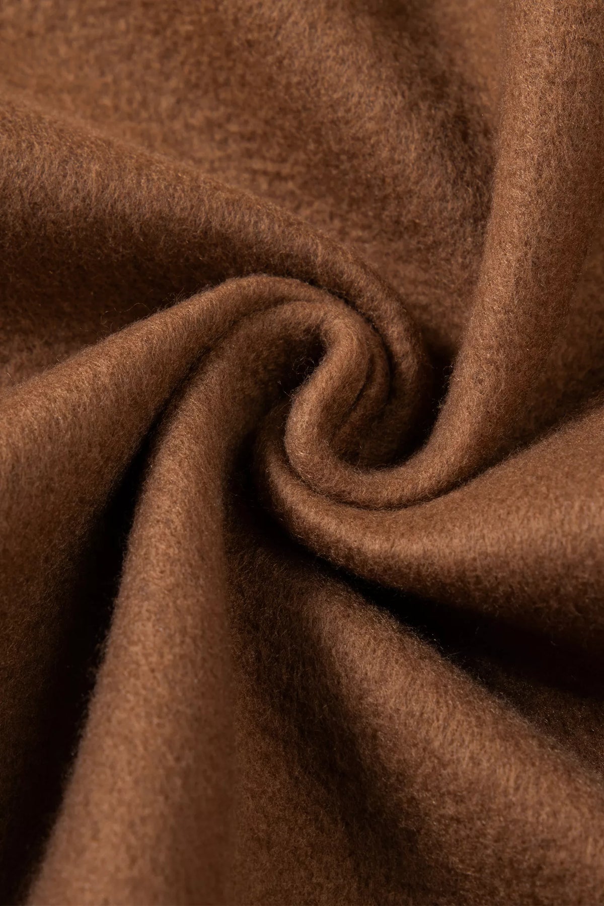 Dark brown knit sweatshirt fabric close-up with soft, heathered texture