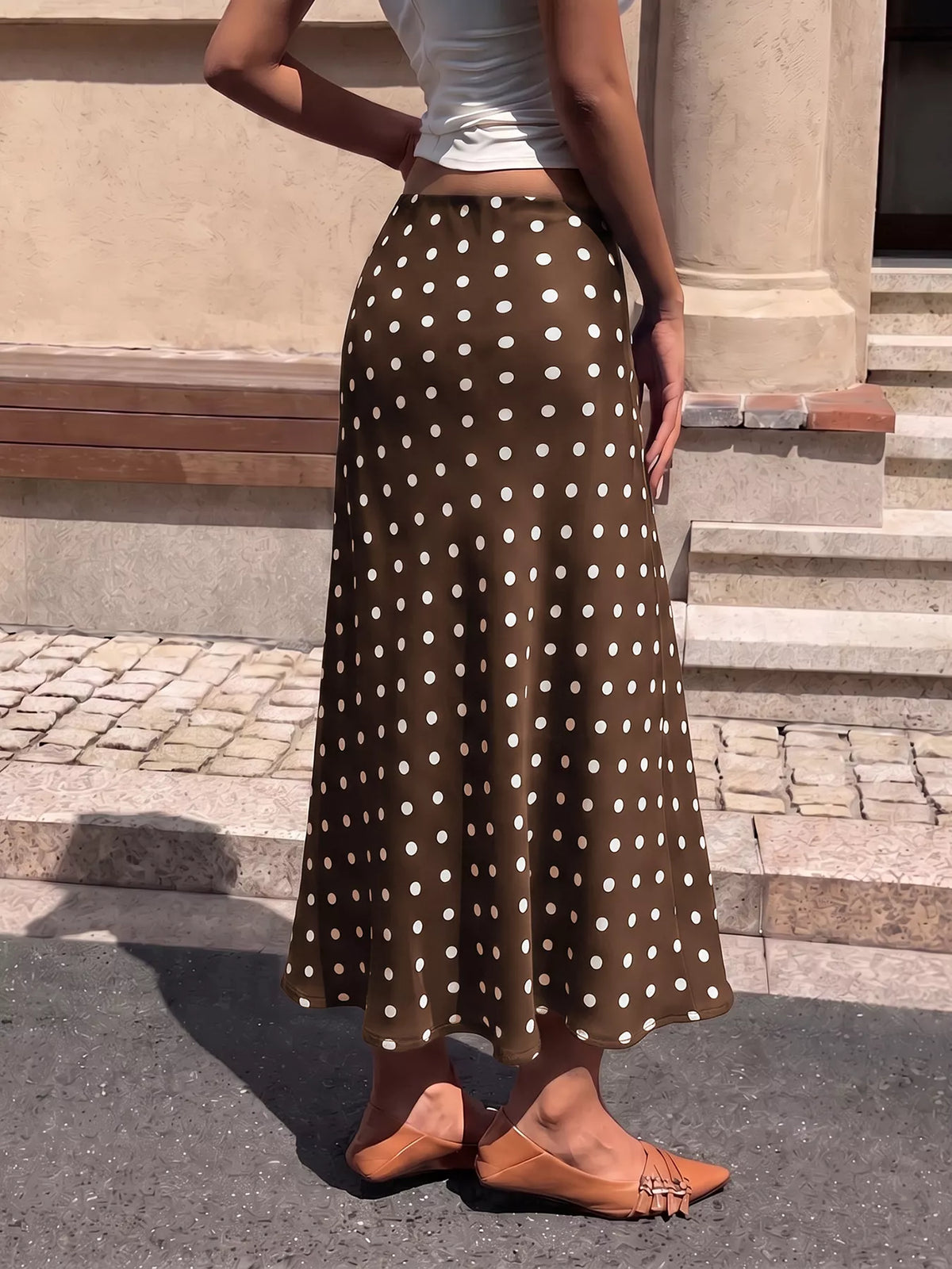 Brown polka-dot midi skirt with white dots and ankle-length swing