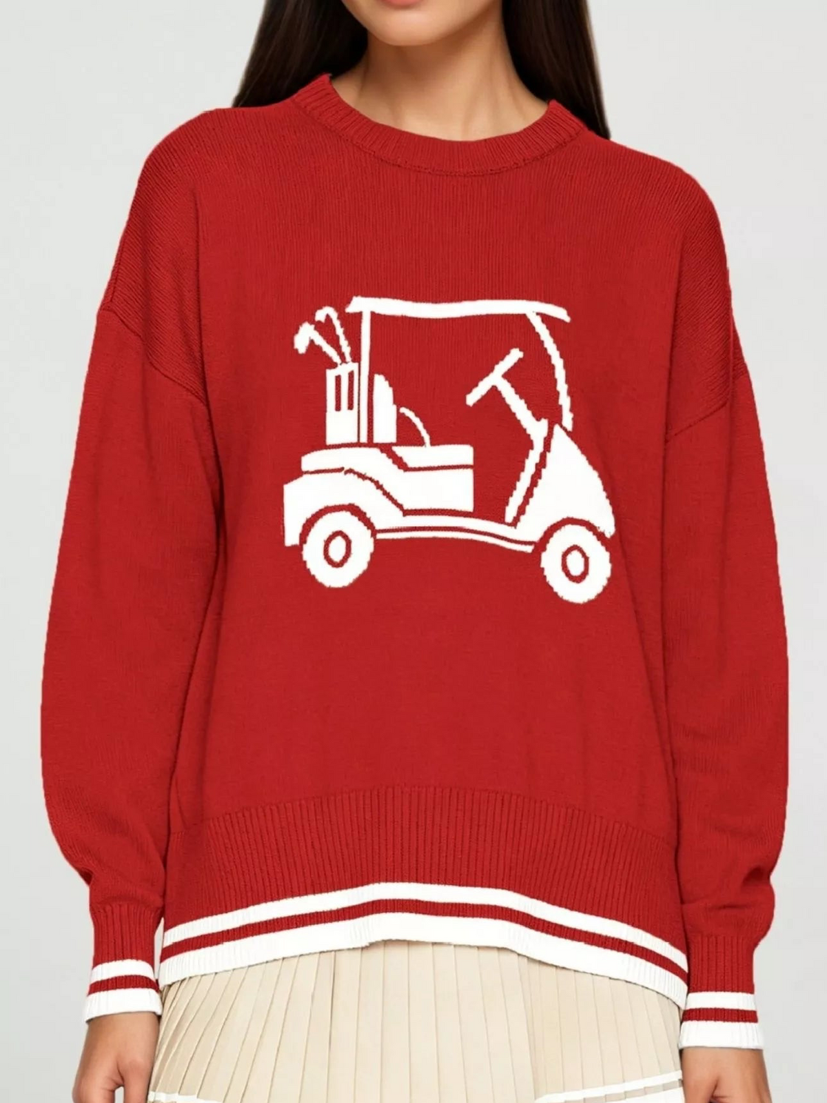 Red golf cart graphic sweater with crew neck, ribbed cuffs, and white striped hem