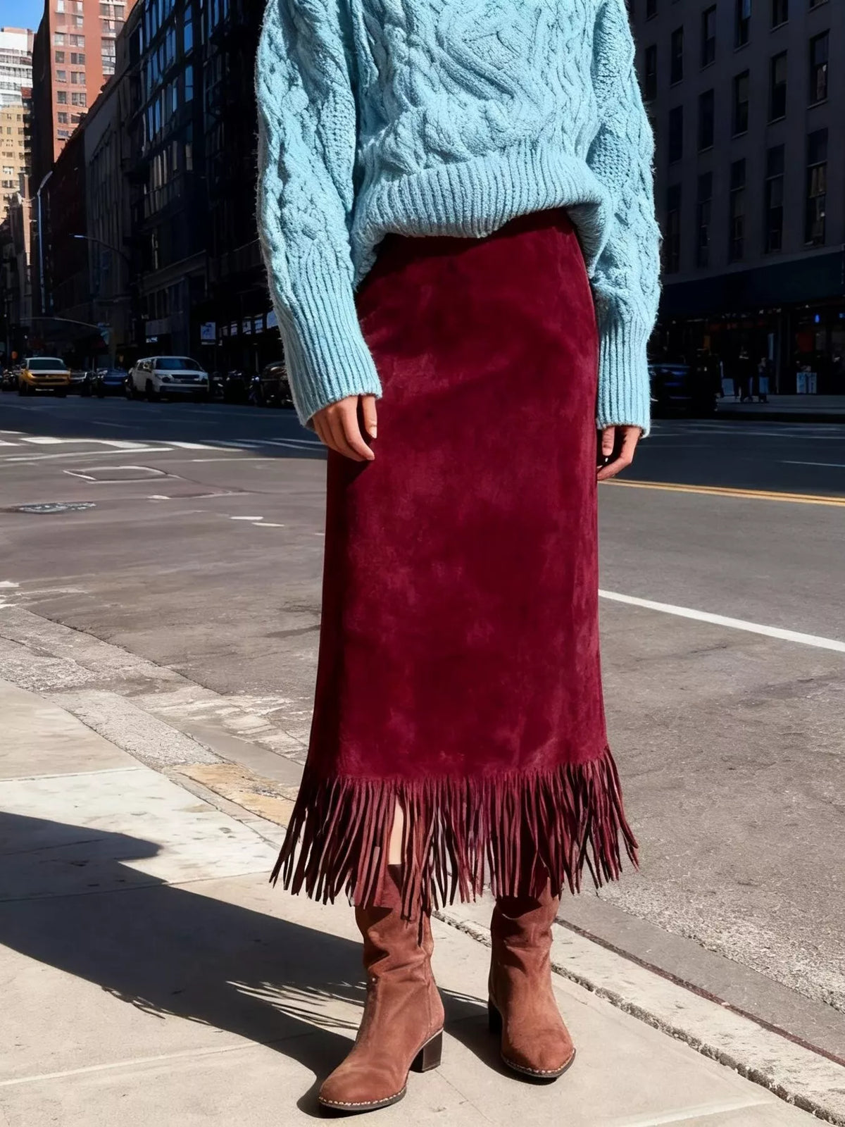 Deep red suede high-waisted midi skirt with long fringe hem