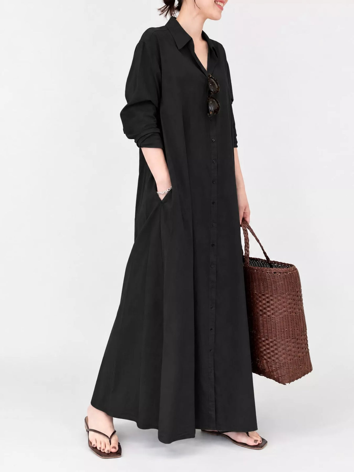 Black button-front long sleeve maxi shirt dress with relaxed fit and side pockets