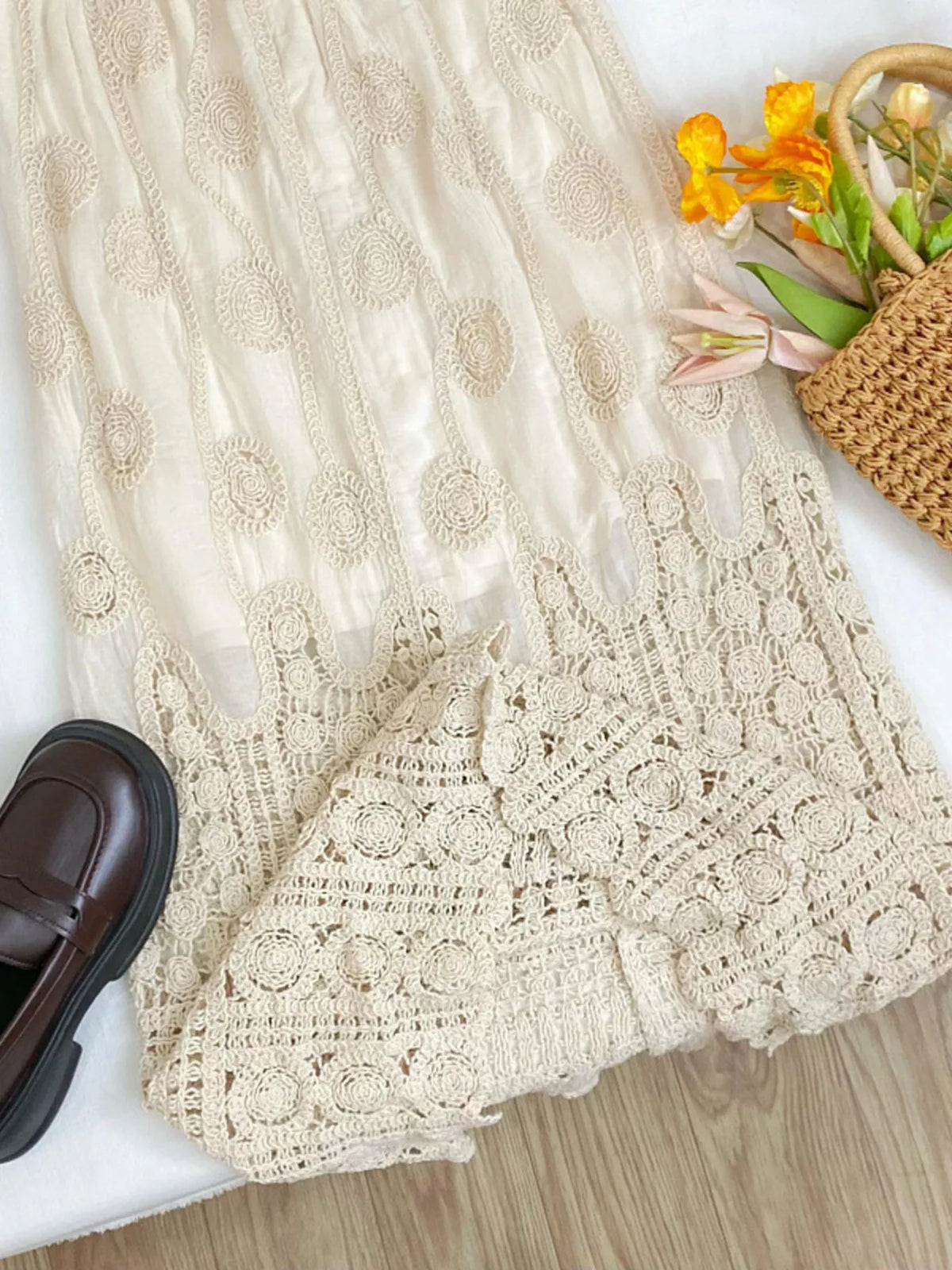 Apricot lace midi skirt with circular motifs and a wide openwork crochet hem