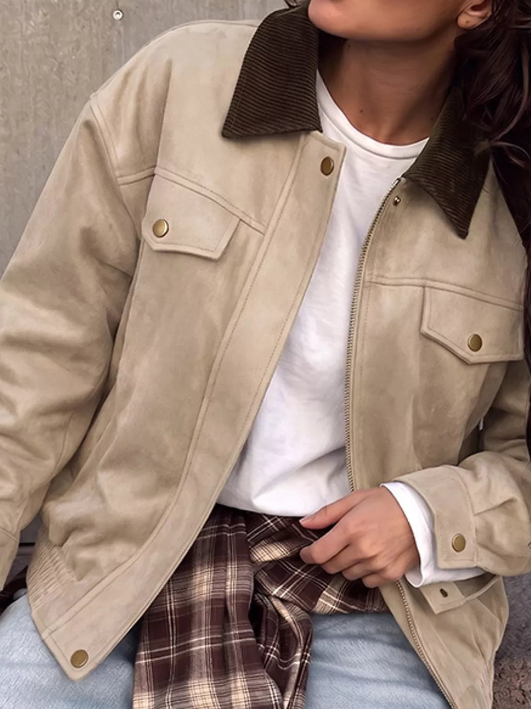 Apricot/beige zip-up jacket with dark corduroy-style collar, snap pockets, and cuffs