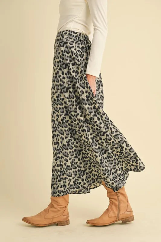 Aemi+Co leopard midi skirt shown from the side with a gently flared hem