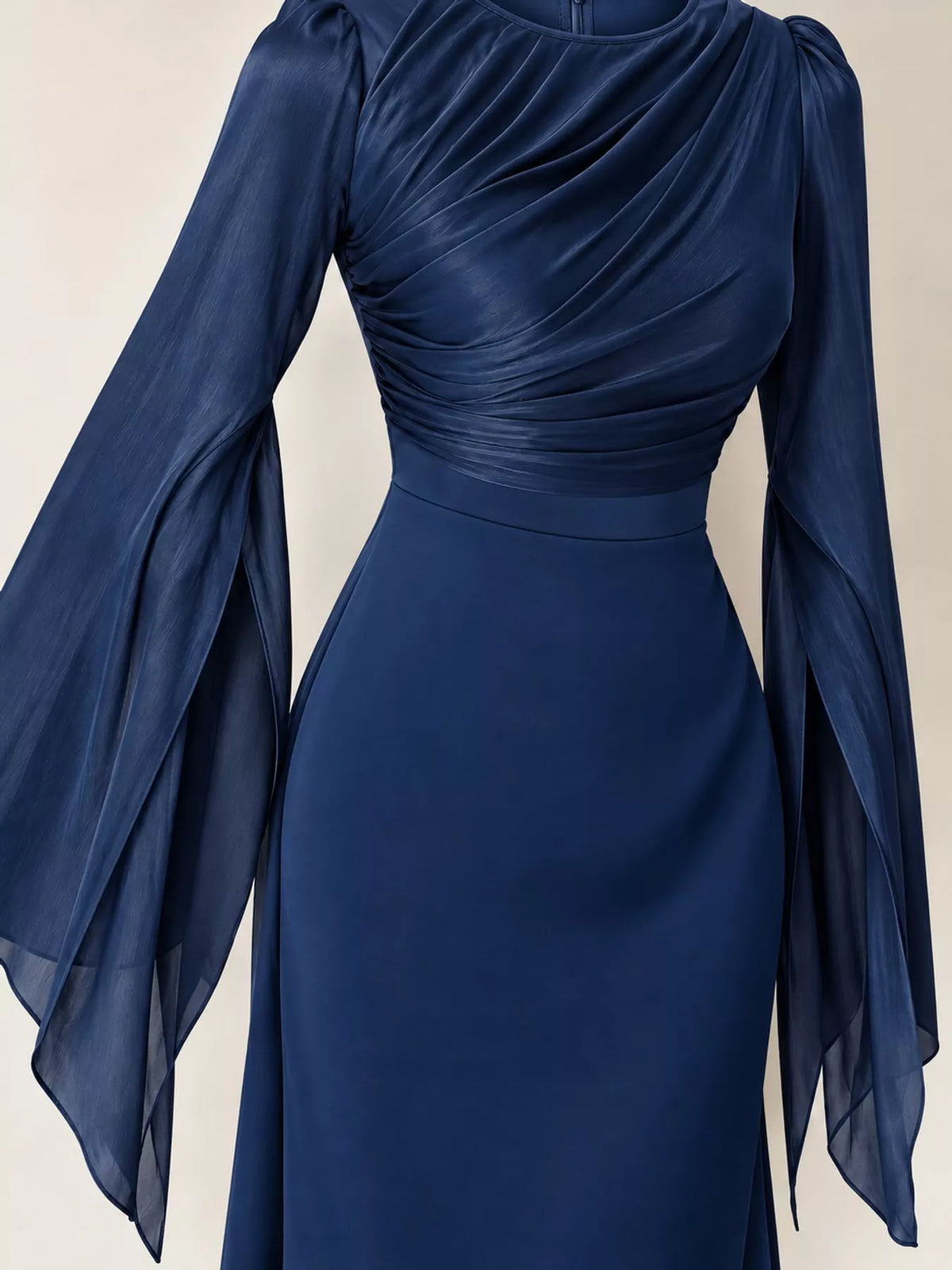 Dark blue maxi dress with a ruched bodice, fitted waist, and sheer flare sleeves