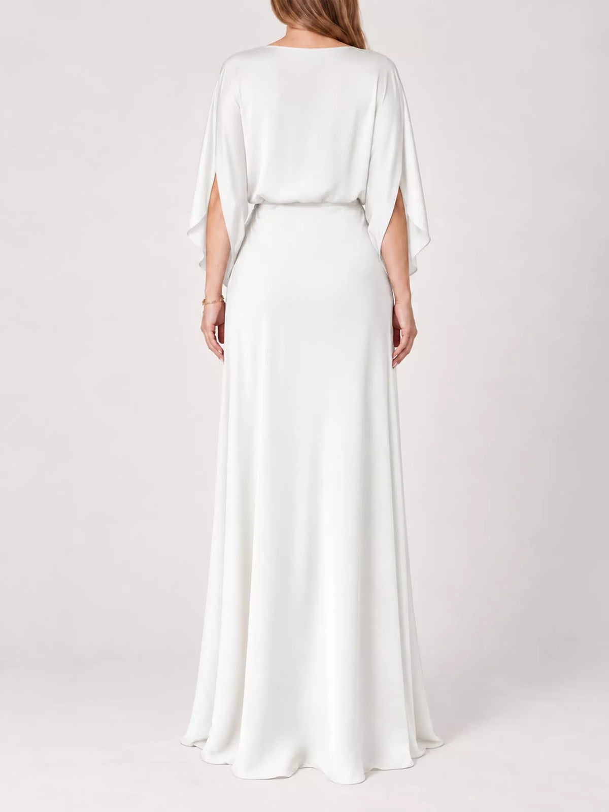 White satin maxi dress, back view with draped neckline and flowing cape sleeves