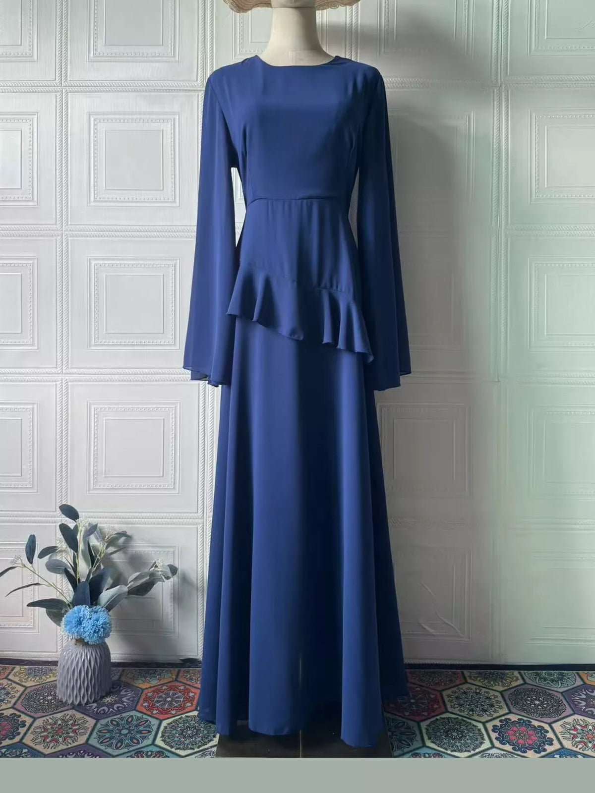 Dark blue plus-size maxi dress with long sleeves and tiered ruffle skirt