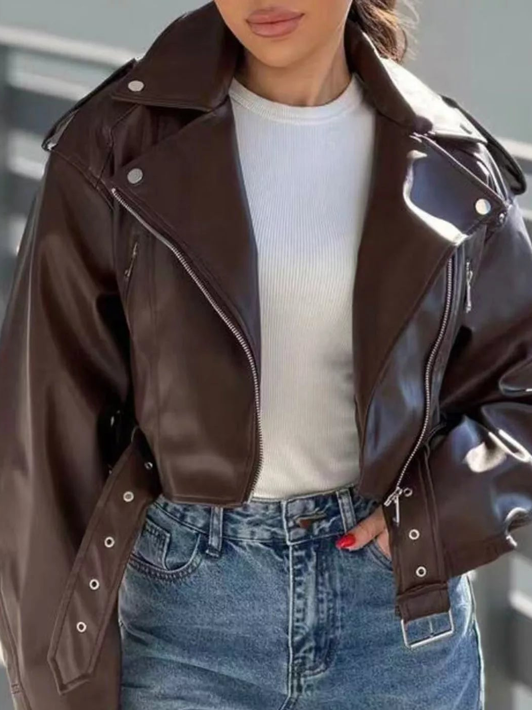 Dark brown faux leather zip-up cropped jacket with stand collar and flap pockets