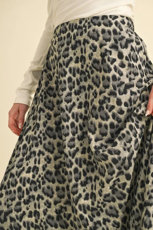 Aemi+Co leopard midi skirt close-up showing the print and gathered waist