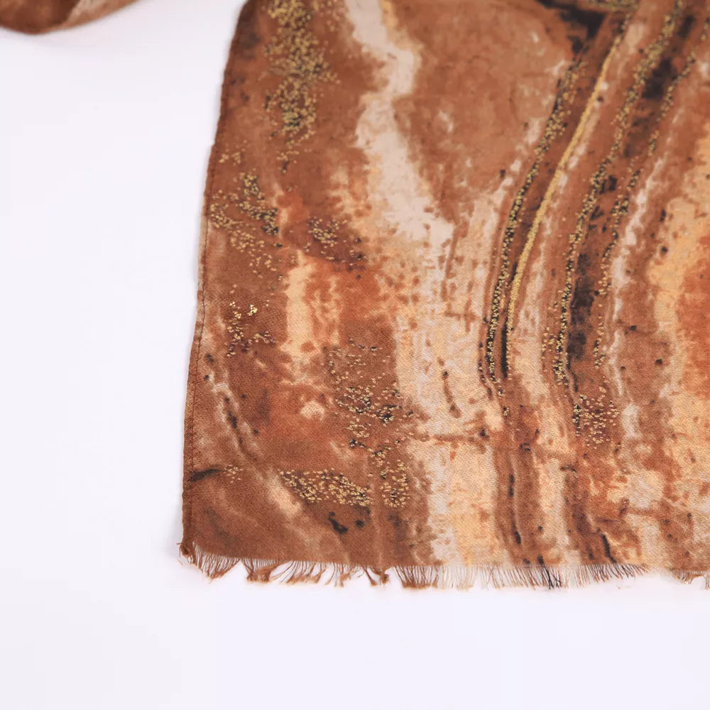 Brown marble print foil scarf close-up with frayed fringe edge
