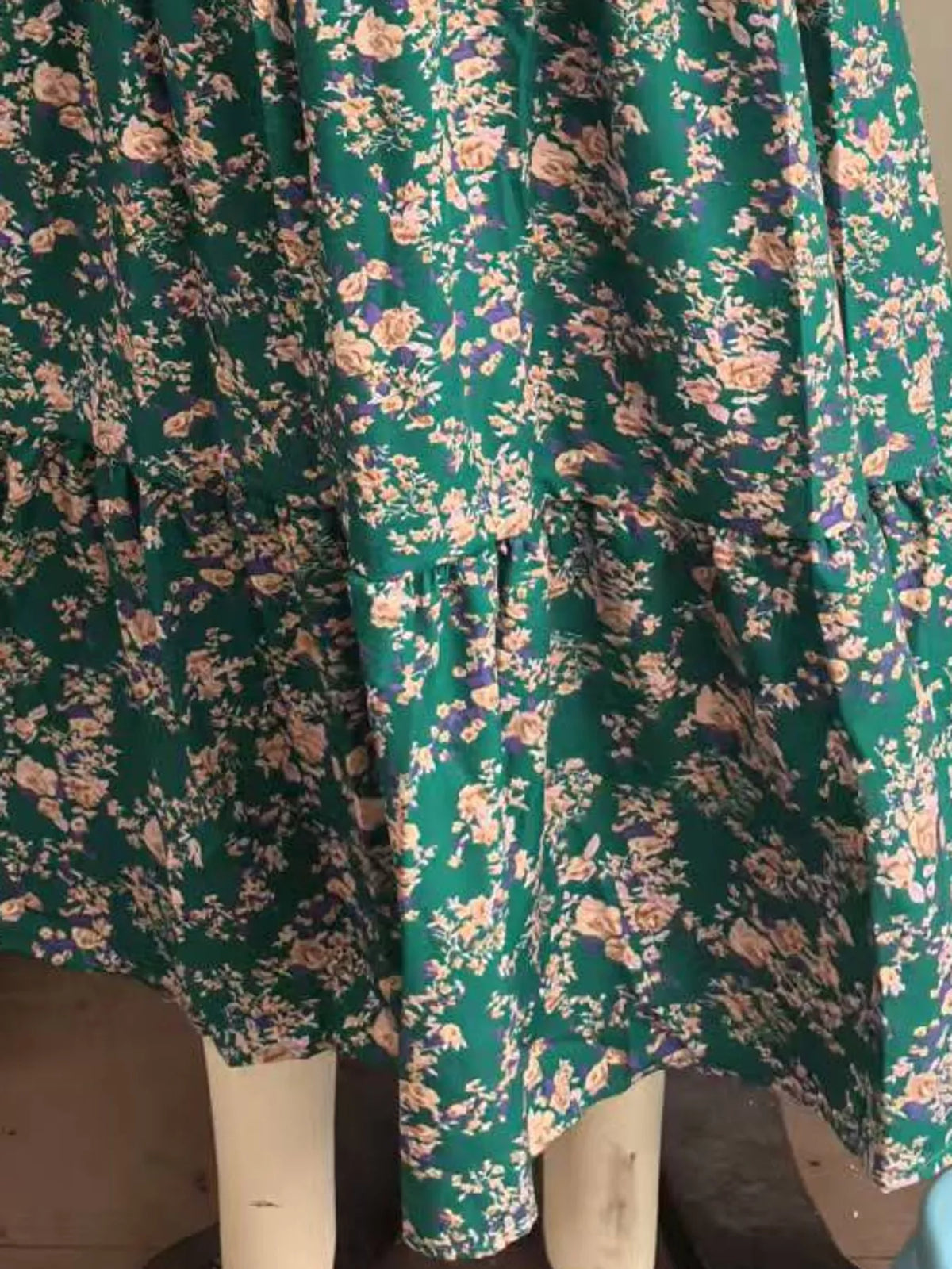 Green floral tiered midi skirt with multiple ruffles and soft gathered vertical seams