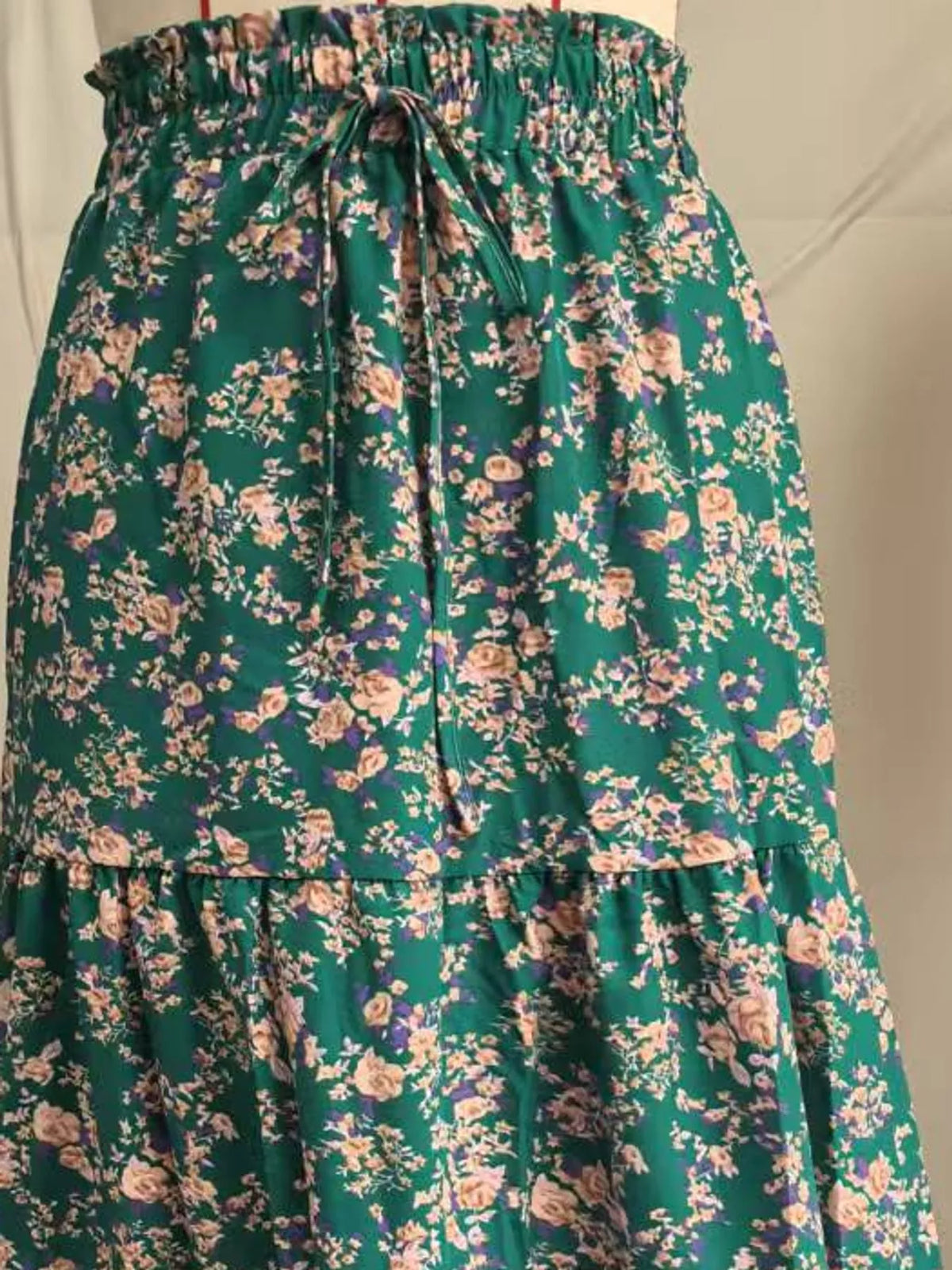 Green floral tiered midi skirt with smocked elastic waistband and ruffled tier hem