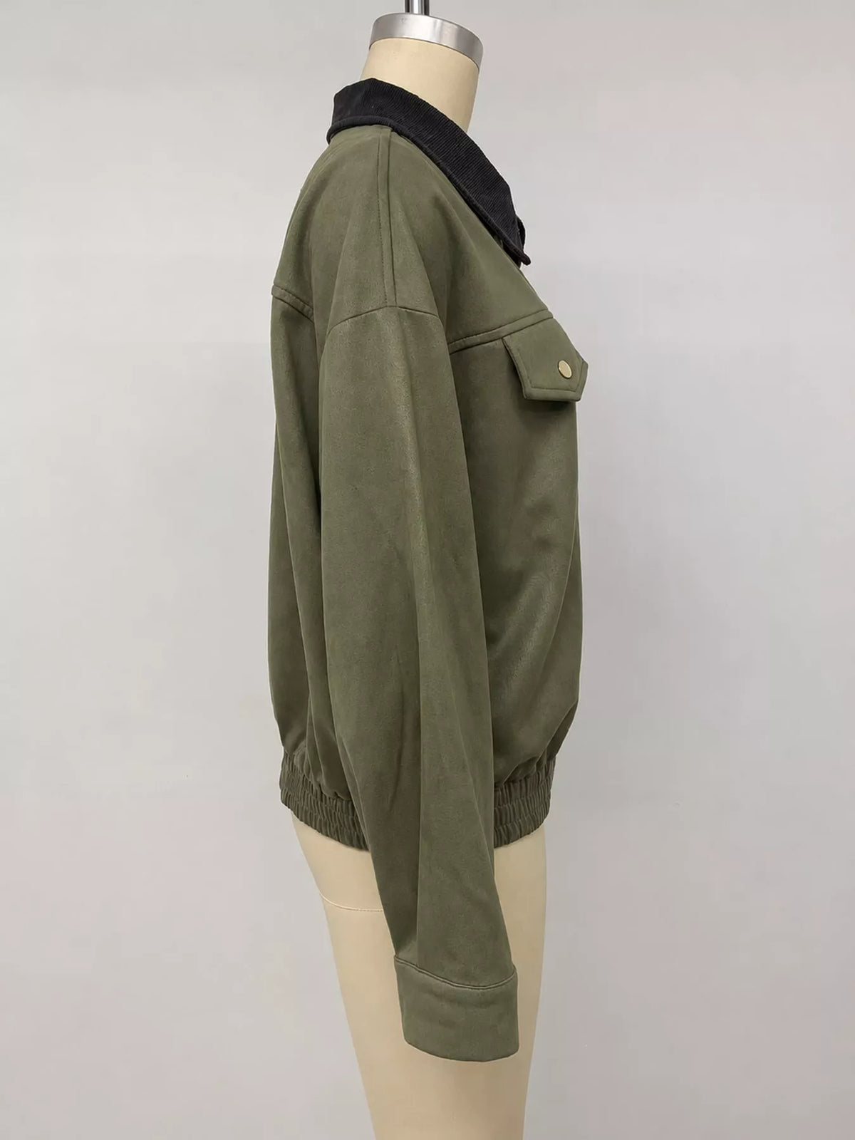 Army green zip-up jacket with dropped shoulders, side pockets, and dark collar