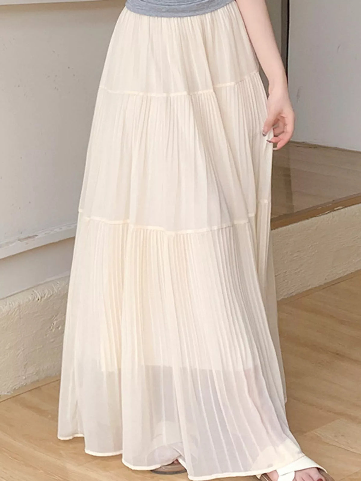 Light beige tiered pleated maxi skirt with high elastic waistband
