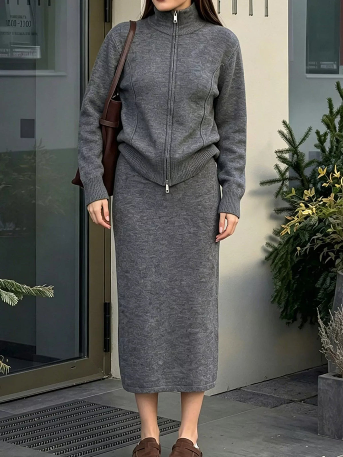 Dark gray sweater set with a fitted zip-front cardigan and straight midi skirt