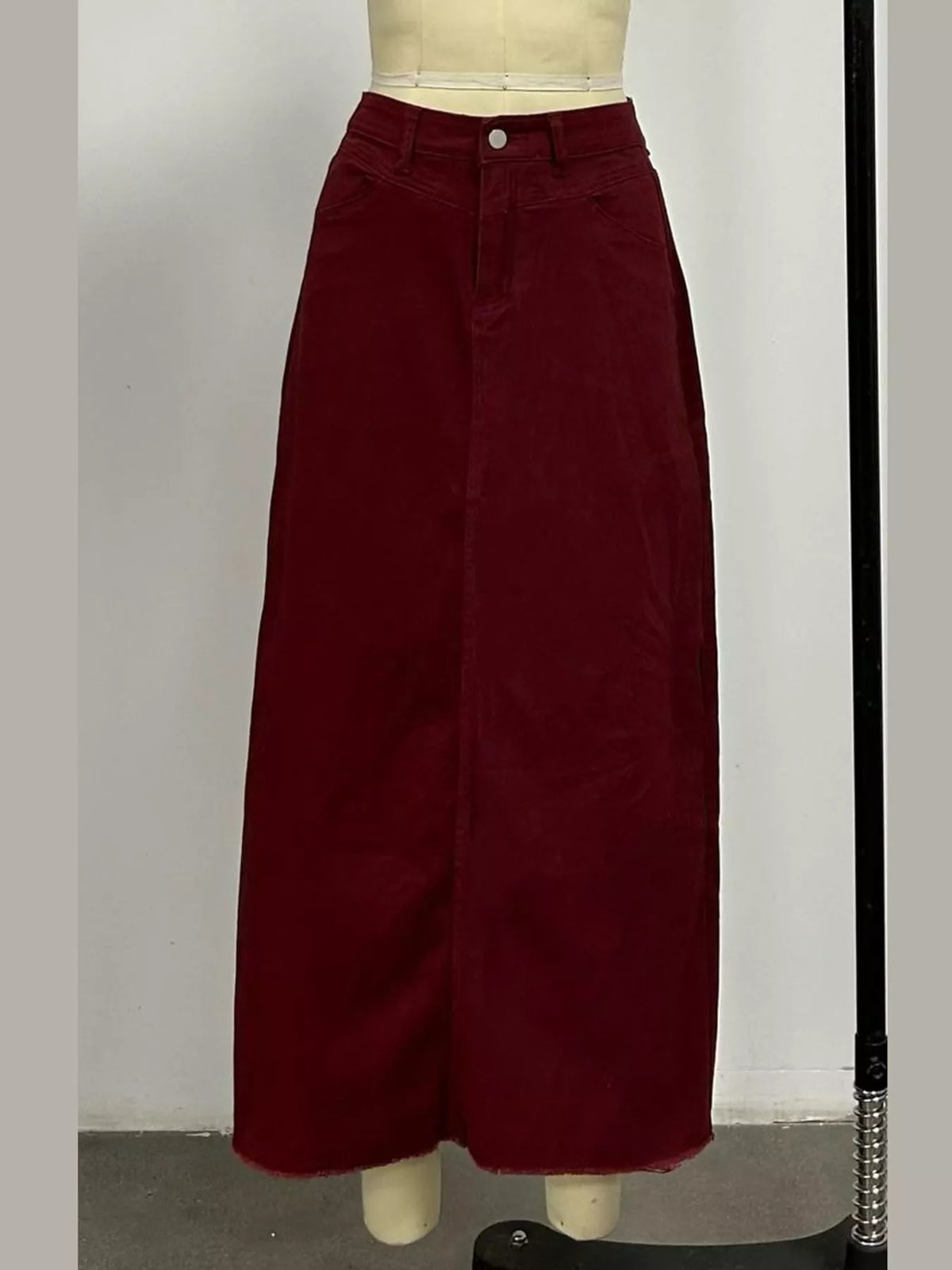 Dark red maxi denim skirt with button closure and wide A-line silhouette