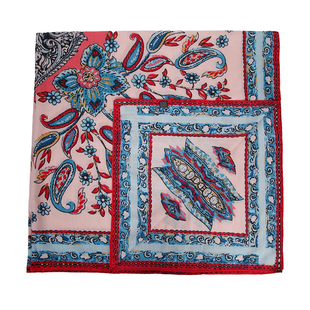 Square silk-feel scarf laid flat, showing red and blue paisley motifs with a framed center.
