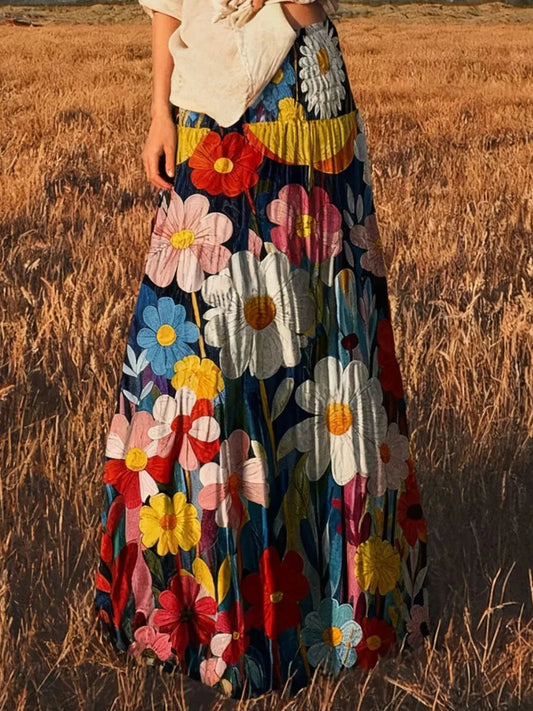 High-waisted maxi skirt with large white, pink, and yellow flowers on dark fabric