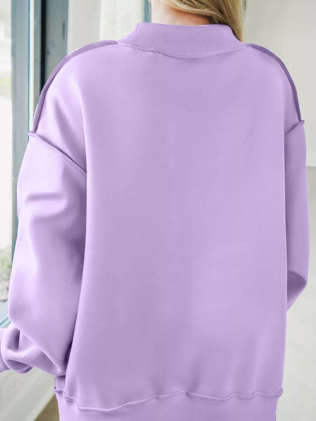 Lavender mock-neck sweatshirt back view, relaxed loose fit