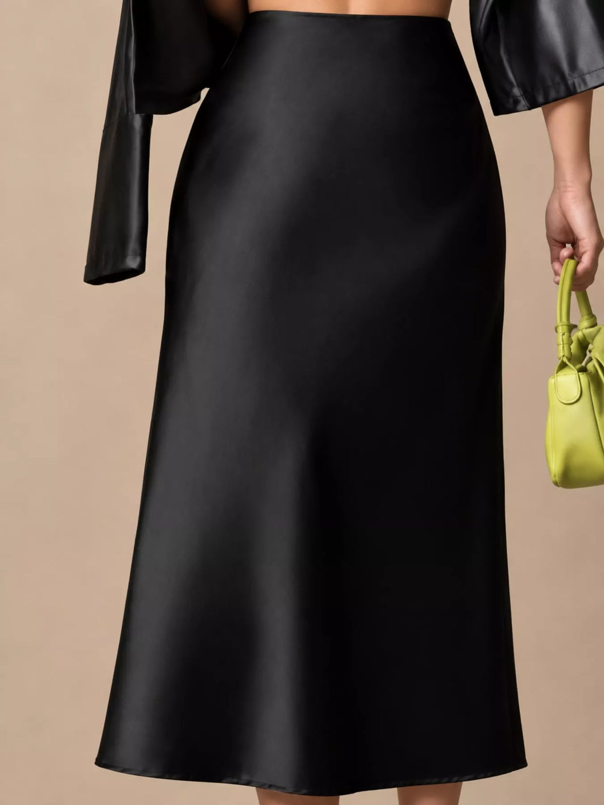 High-waisted satin midi skirt in black, wide waistband and flowing skirt length
