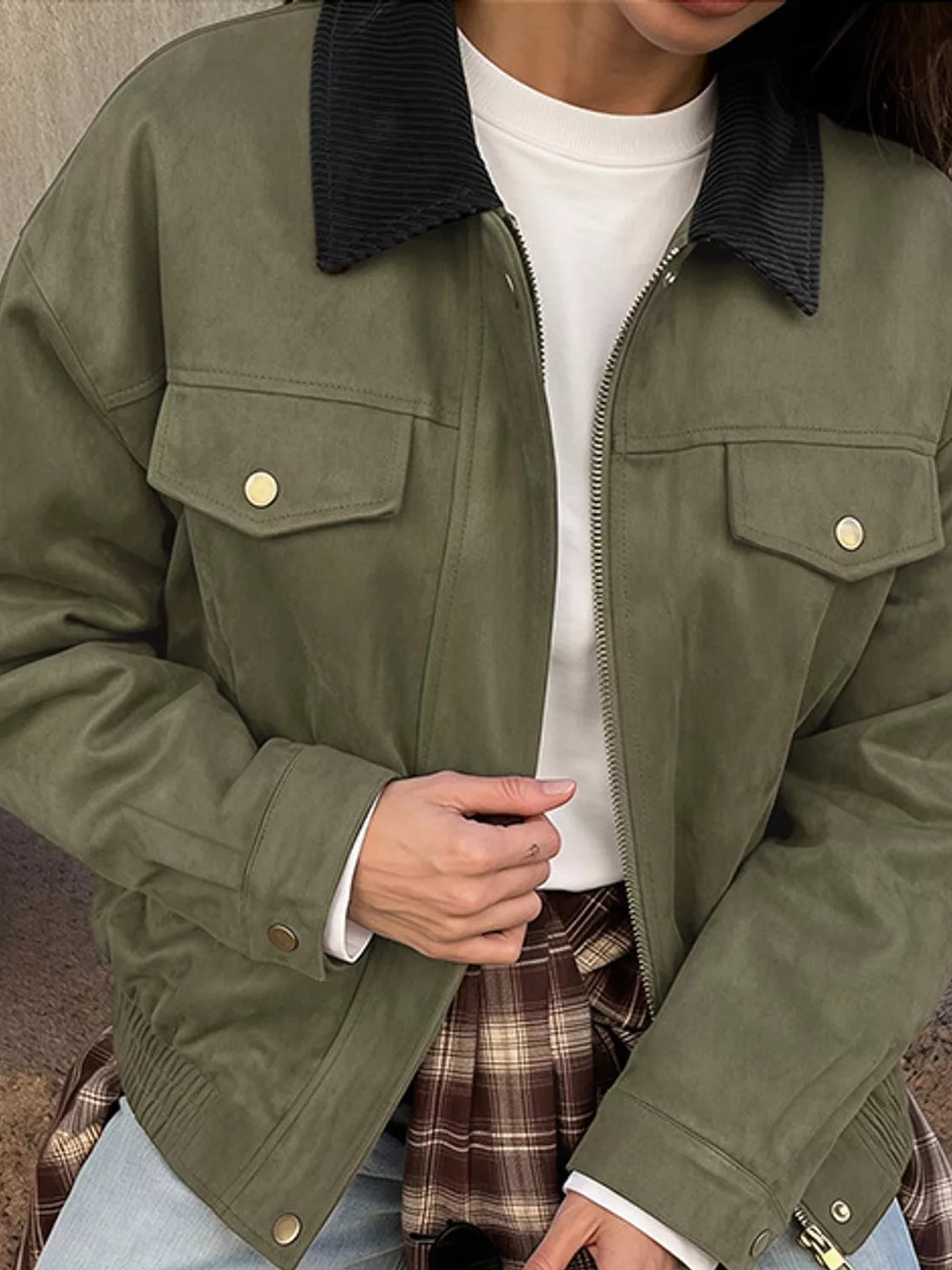 Army green zip-up jacket close-up with snap flap chest pocket and zipper