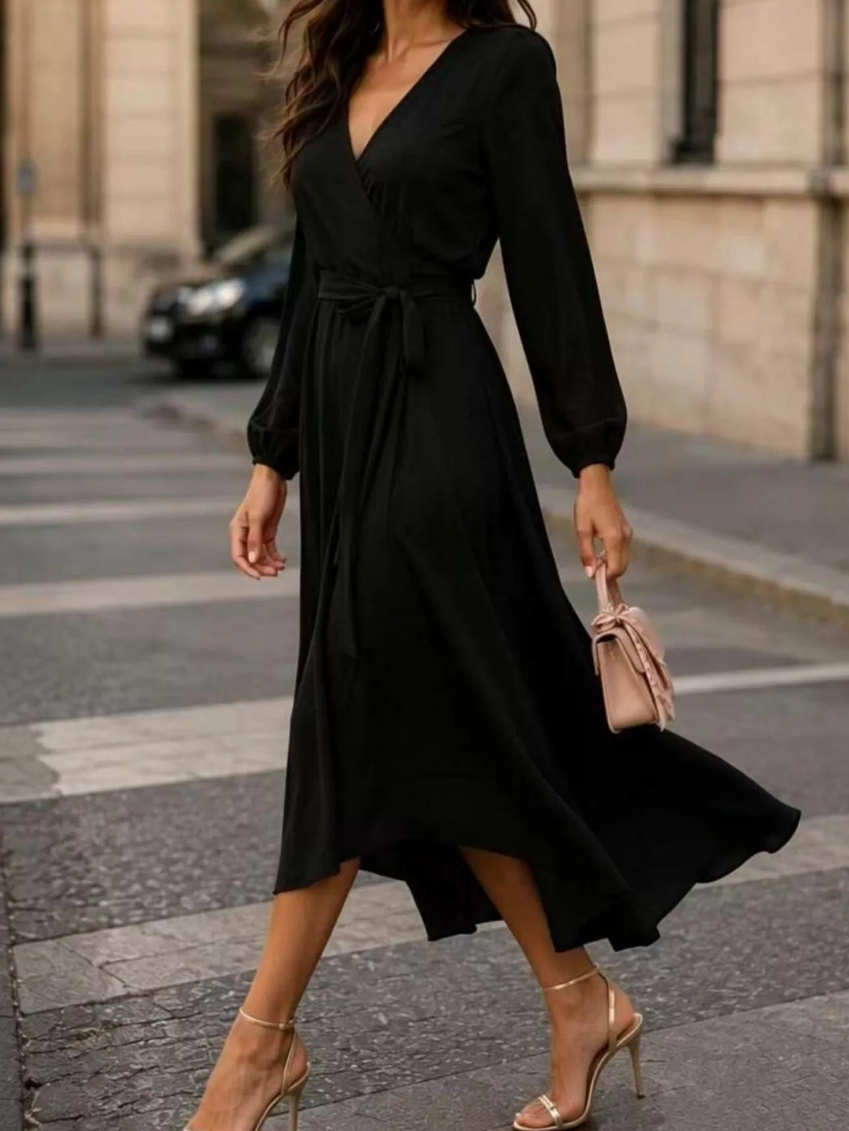 Black long-sleeve wrap dress with V-neck and waist tie, mid-calf asymmetric hem.
