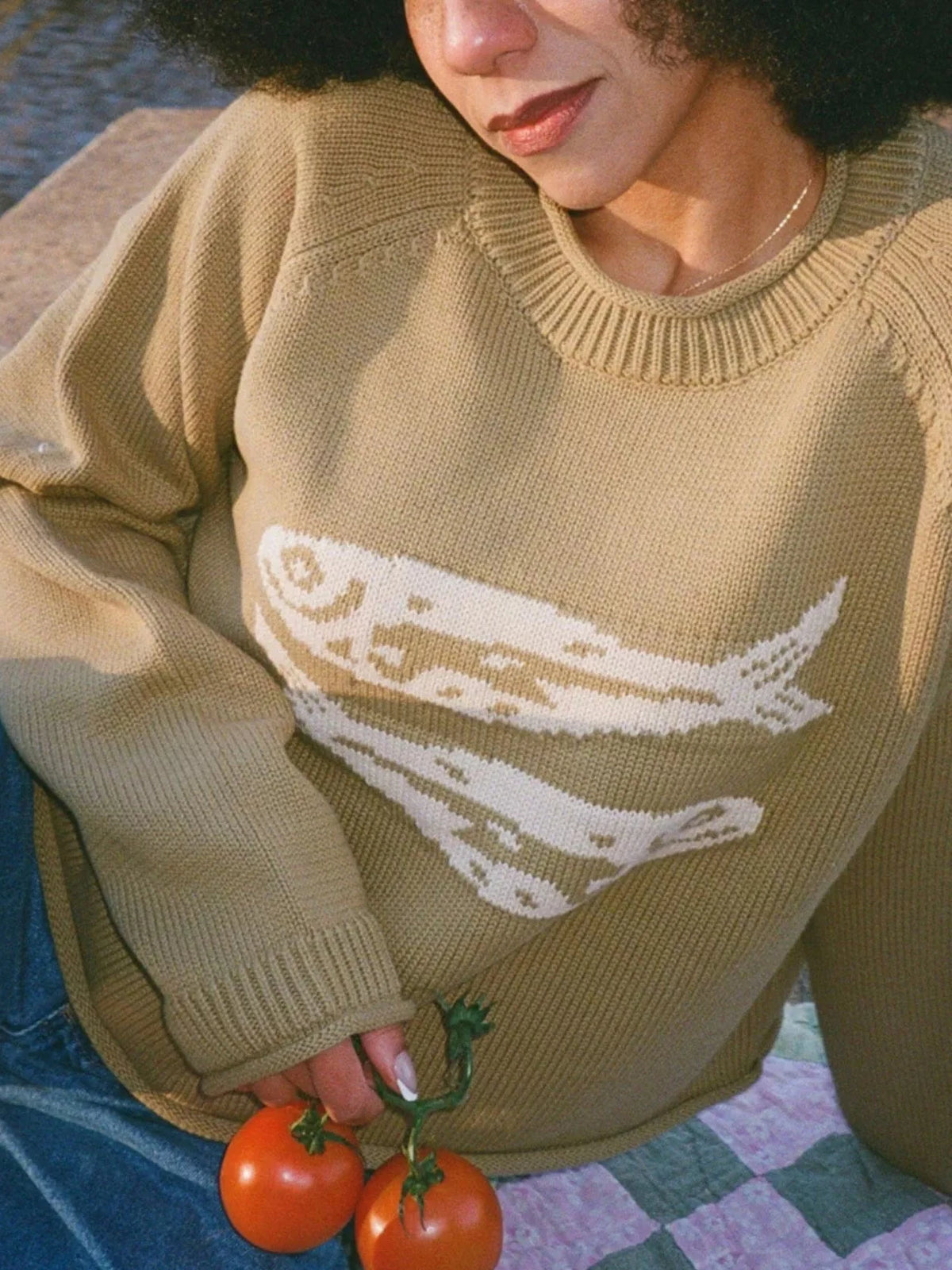 Olive green crewneck knit sweater with white fish graphic on front