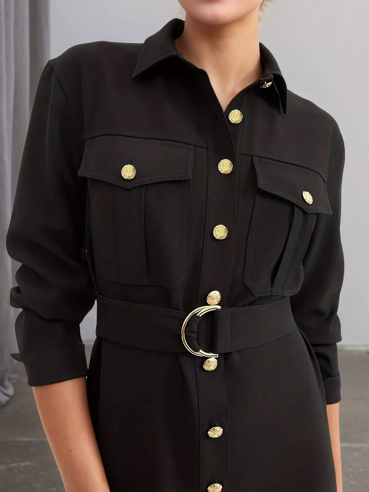 Black button-front long sleeve midi dress with flap pockets, gold buttons, and belt ring