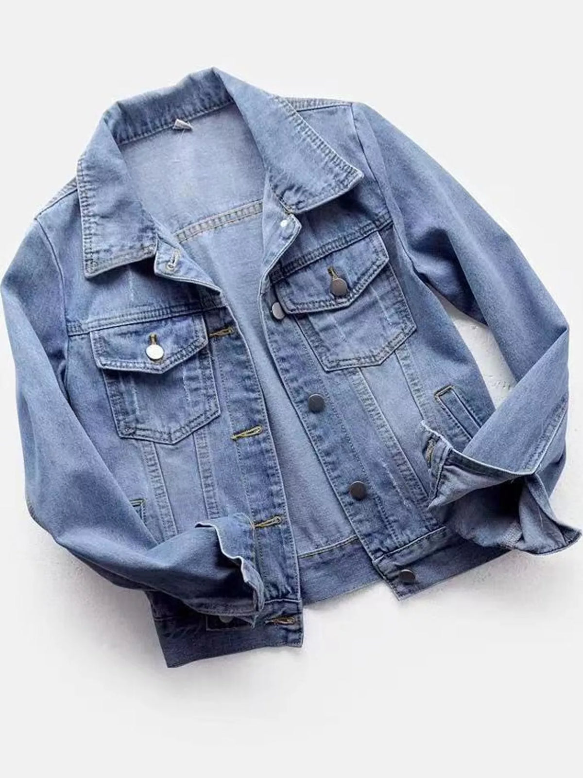Light wash plus-size denim button-front jacket with chest pockets and pointed collar
