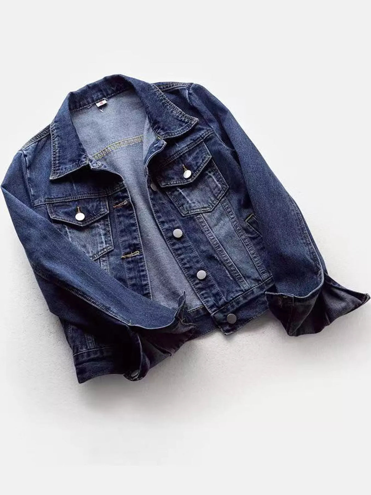 Dark wash plus-size denim button-front jacket with chest flap pockets, front view
