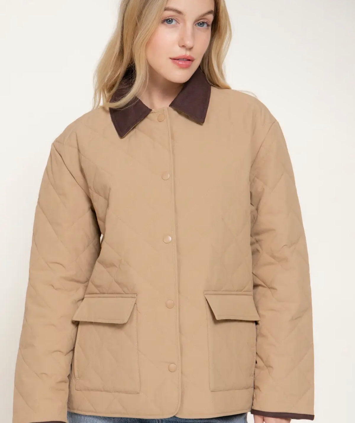 Tan quilted puffer jacket with brown collar, button-up front, two flap pockets