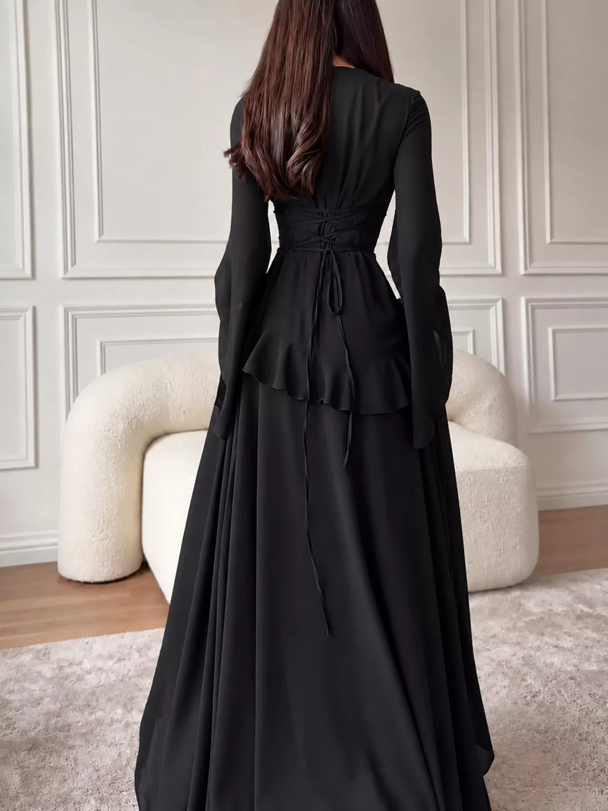 Plus size ruffled flare sleeve maxi dress in black, back view with lace-up waist