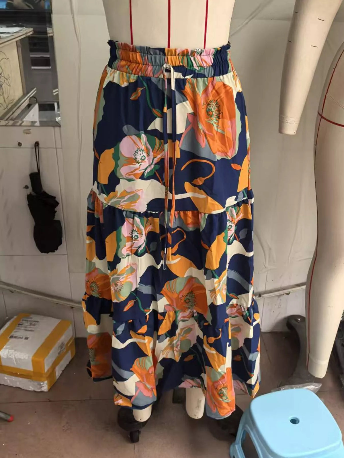 Navy floral tiered midi skirt with orange flowers, elastic waist and drawstring ties