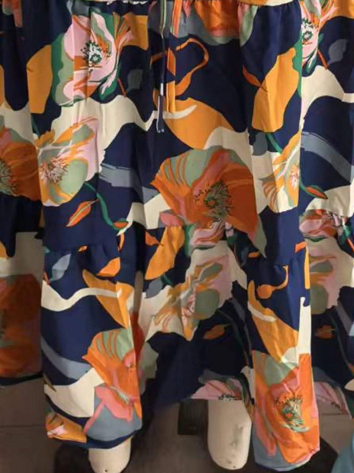 Navy floral tiered midi skirt with orange and cream flower print and gathered tiers