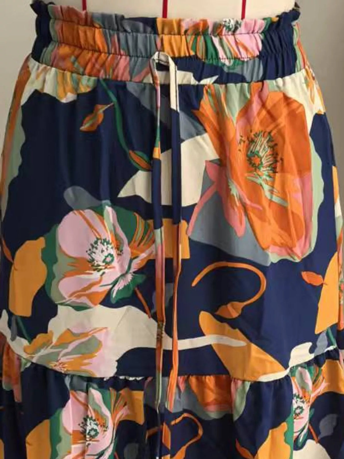 Navy floral tiered midi skirt with large blossoms and gathered elastic waistband