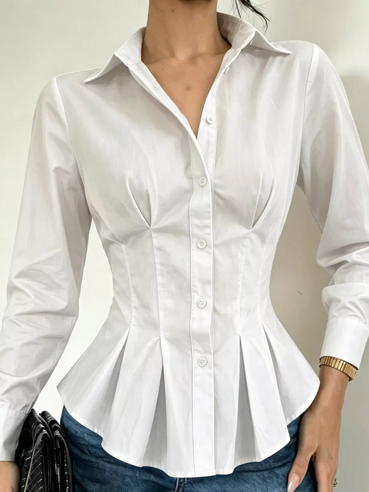 White button-down peplum blouse with fitted waist, button placket, long sleeves