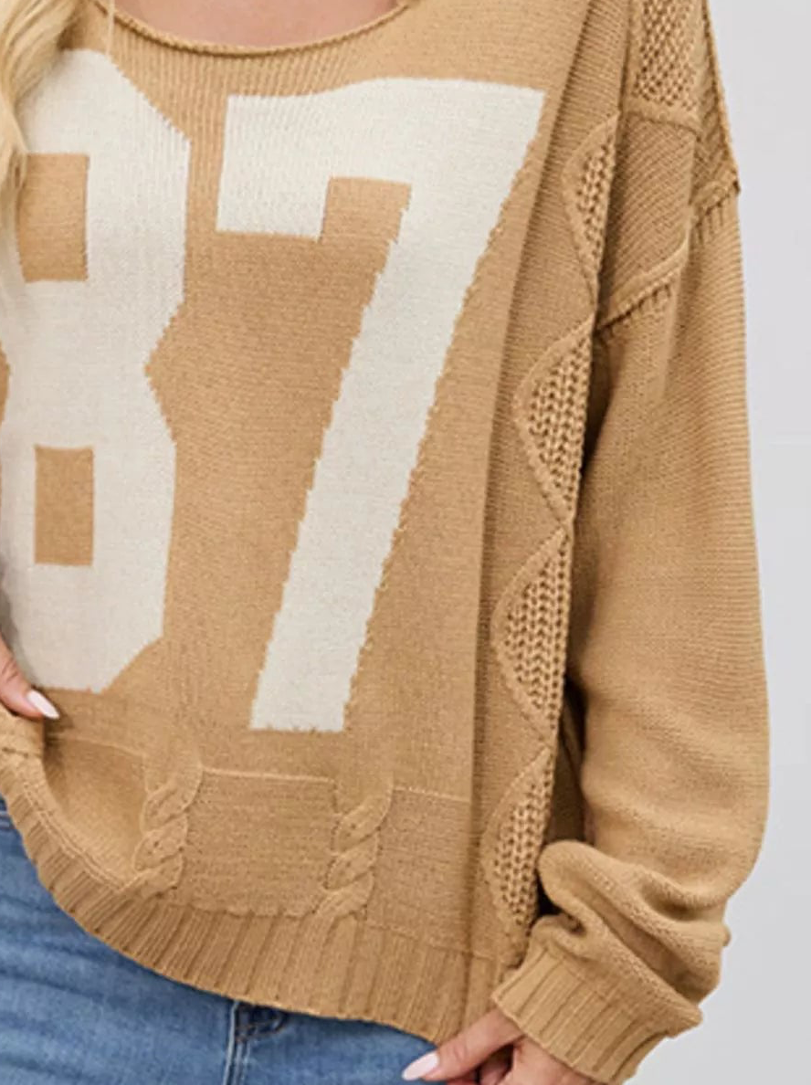 Tan cable-knit sweater with cream 87 number graphic and textured sleeve details