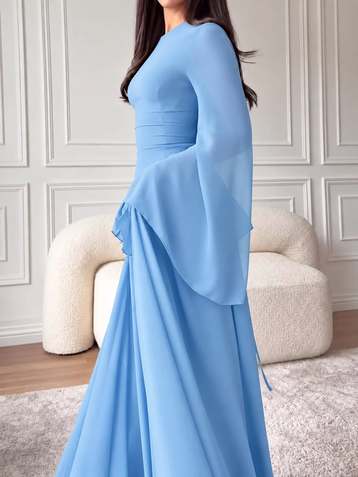 Light blue plus-size maxi dress with ruffled waist detail and flowing flared skirt