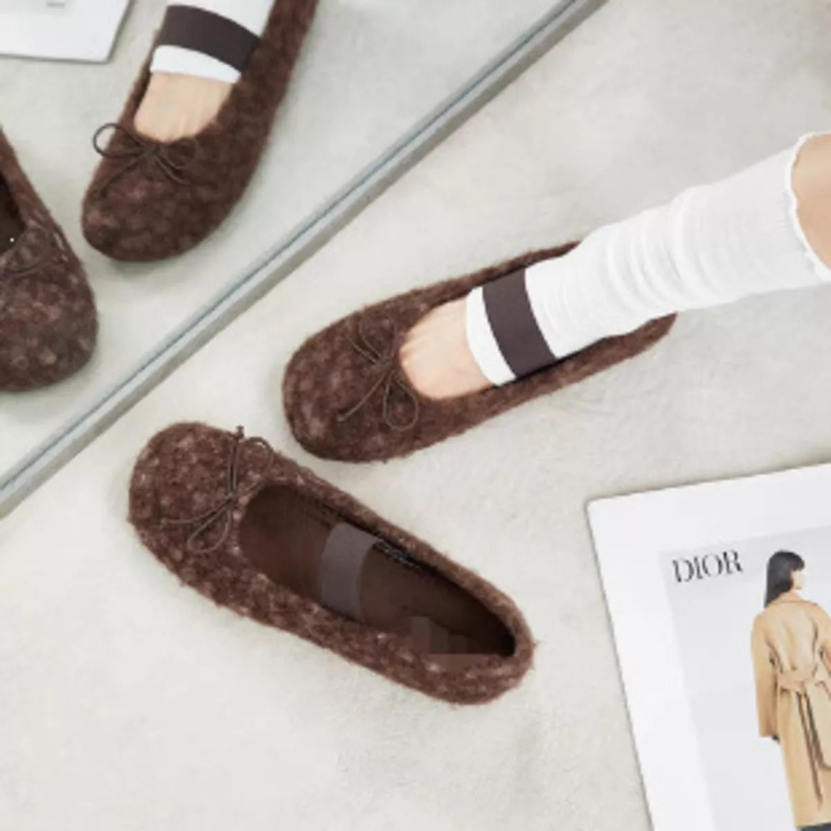 Coffee-brown faux fur slip-on flats with dark band and bow-tie eyelets