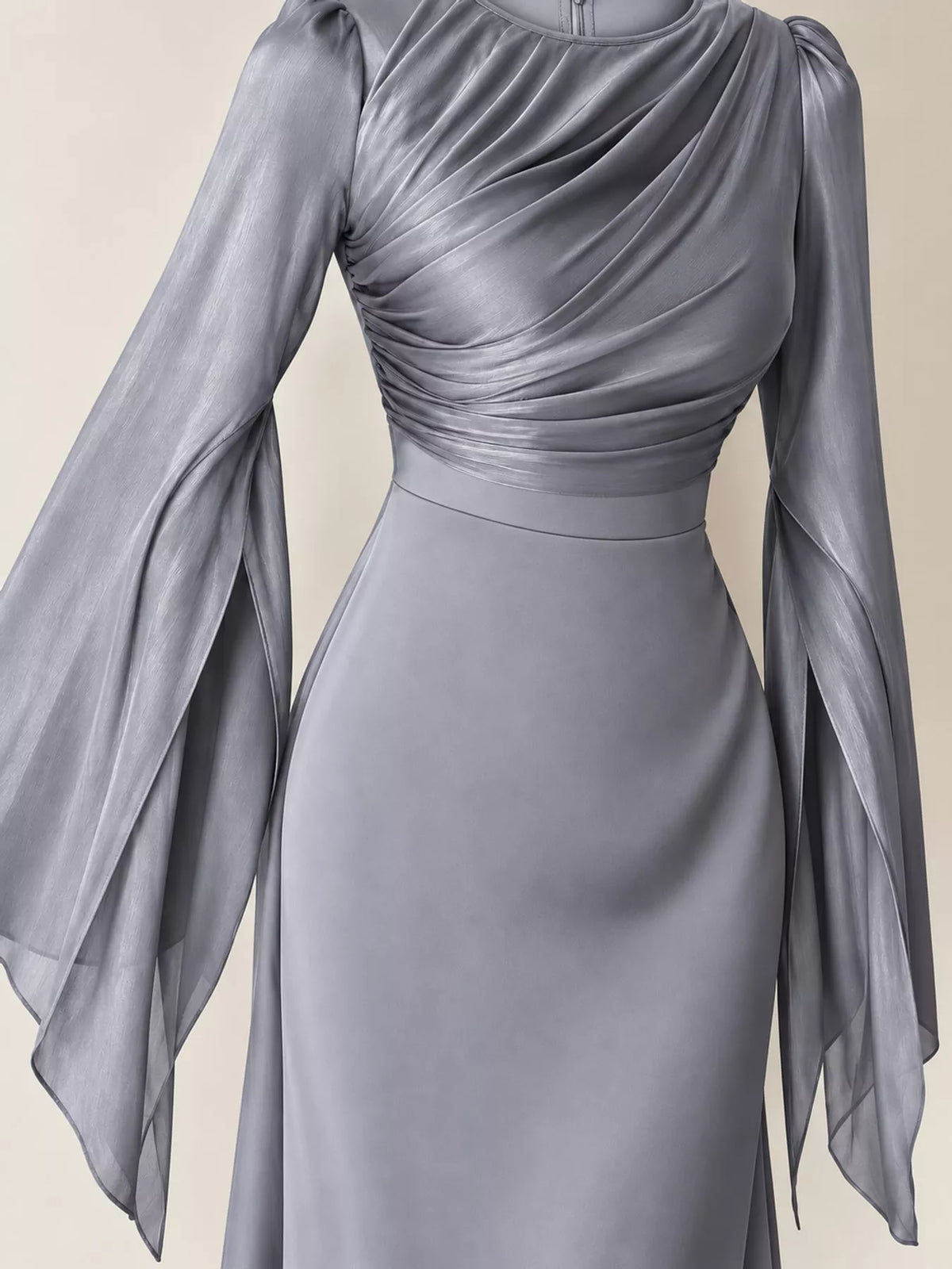 Gray maxi dress with a ruched bodice, fitted waist, and sheer flared sleeves
