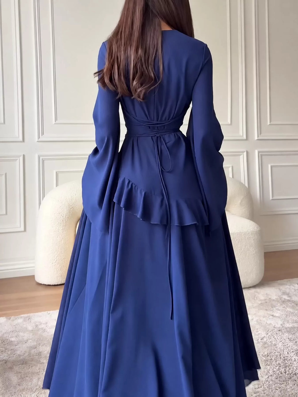 Dark blue plus-size maxi dress with back tie detail and ruffled tiered skirt