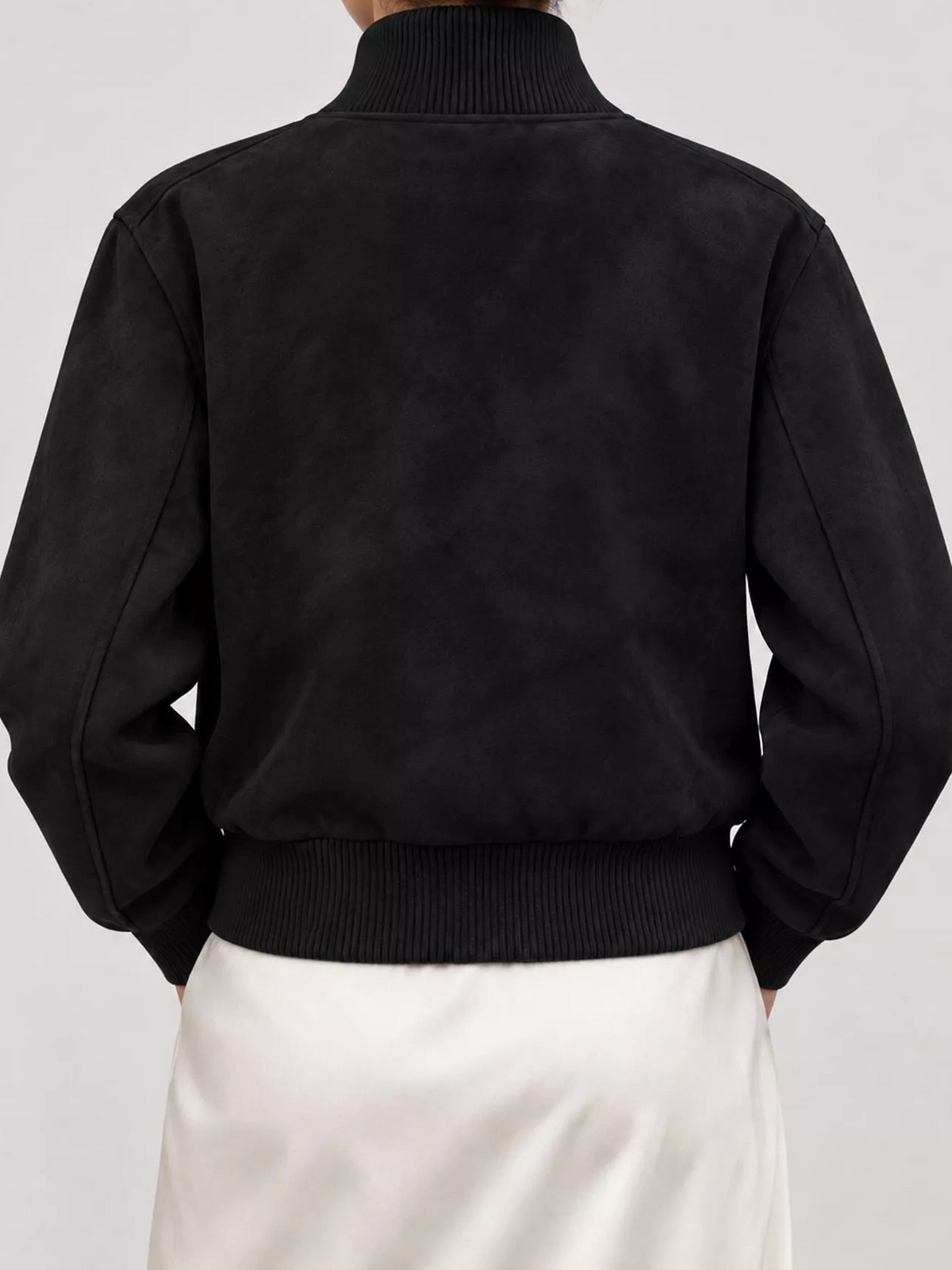 Back view black zip-up long-sleeve jacket with ribbed collar and hem