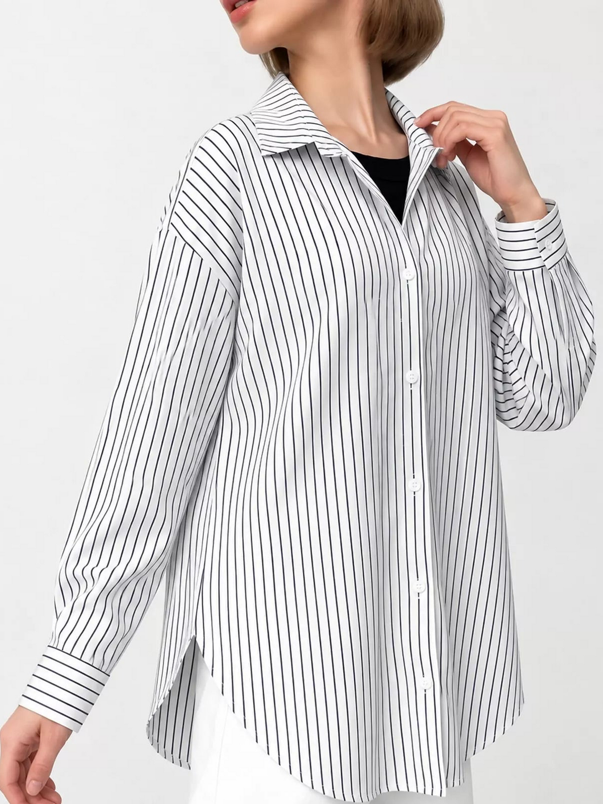 Black and white vertical striped button-up long sleeve shirt with button placket
