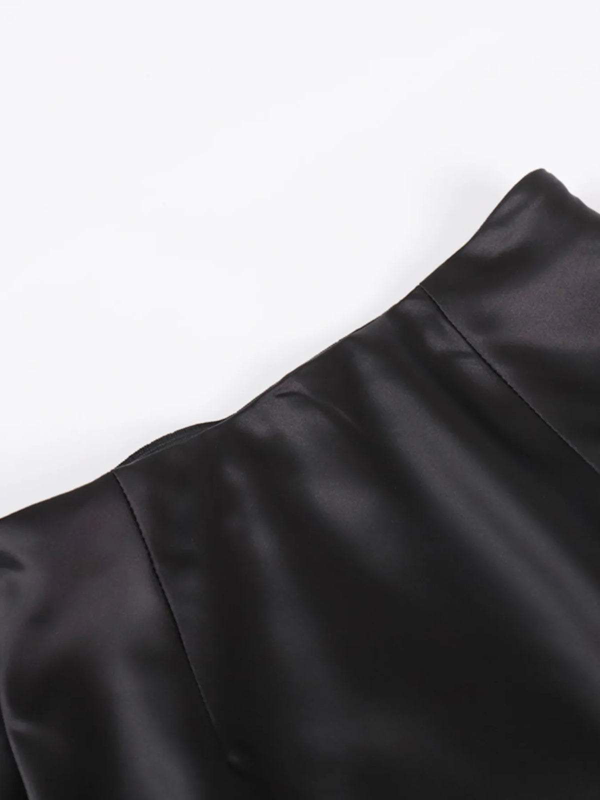 Close-up of black waistband seam detail on high-waisted maxi skirt