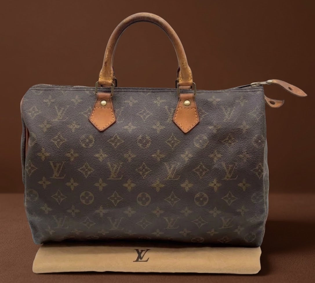 Louis Vuitton Speedy 35 bag full front view with monogram canvas and leather handles
