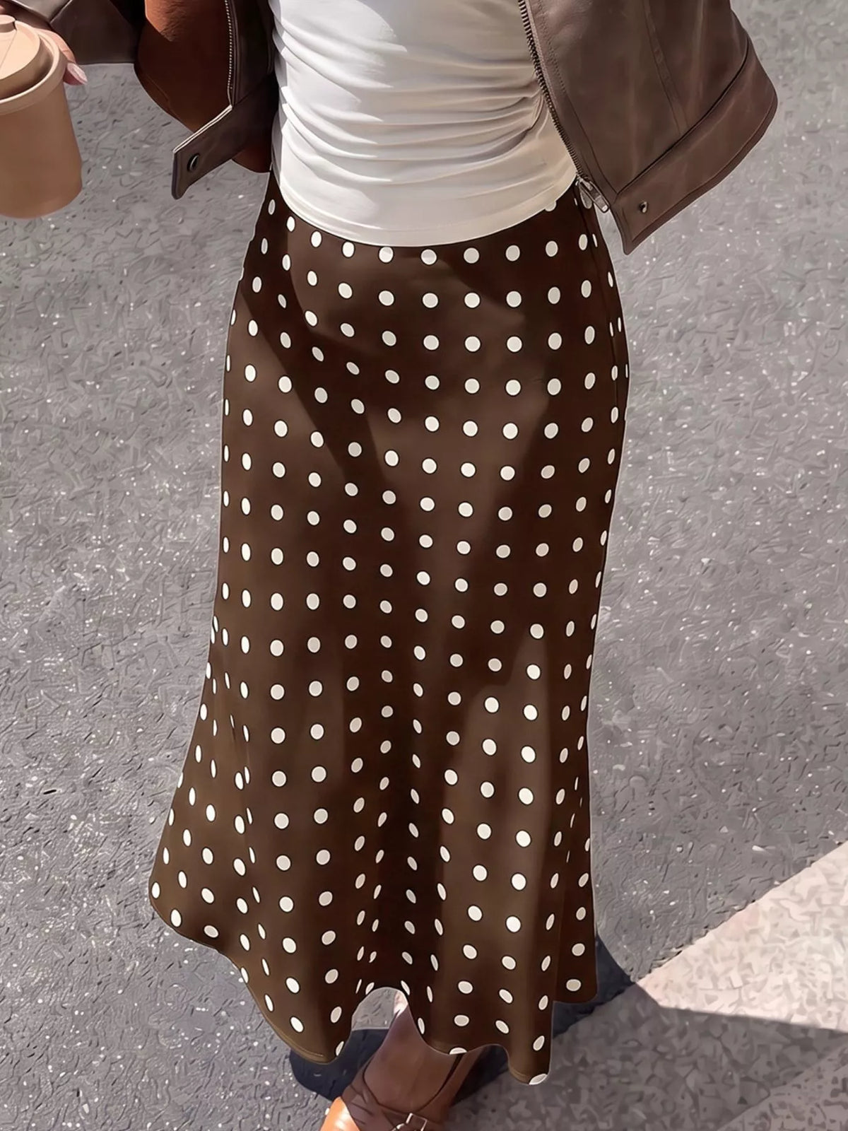 Brown polka-dot midi skirt with white dots and straight, swaying hem