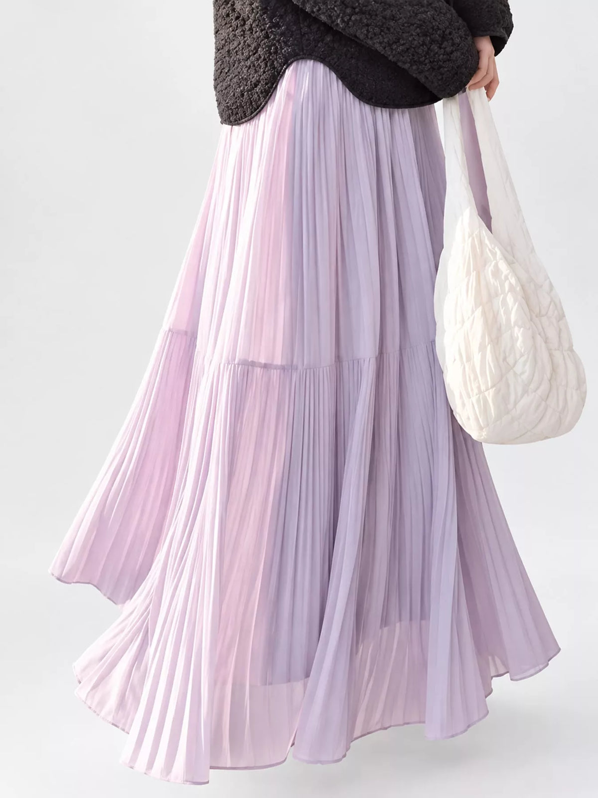 Light purple tiered pleated maxi skirt with elastic waistband and full flowing tiers