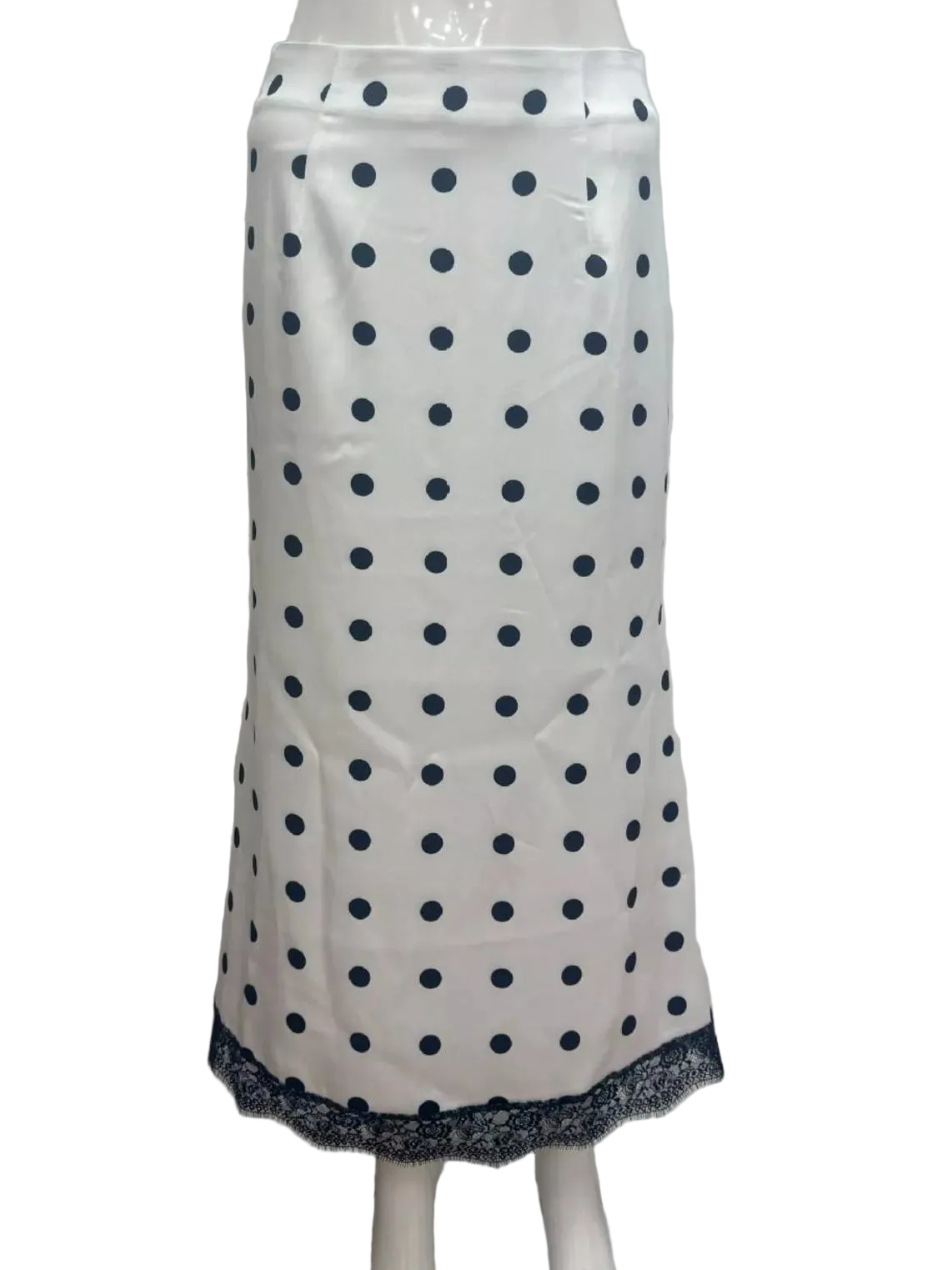 White polka dot midi skirt with lace hem, shown from the front.