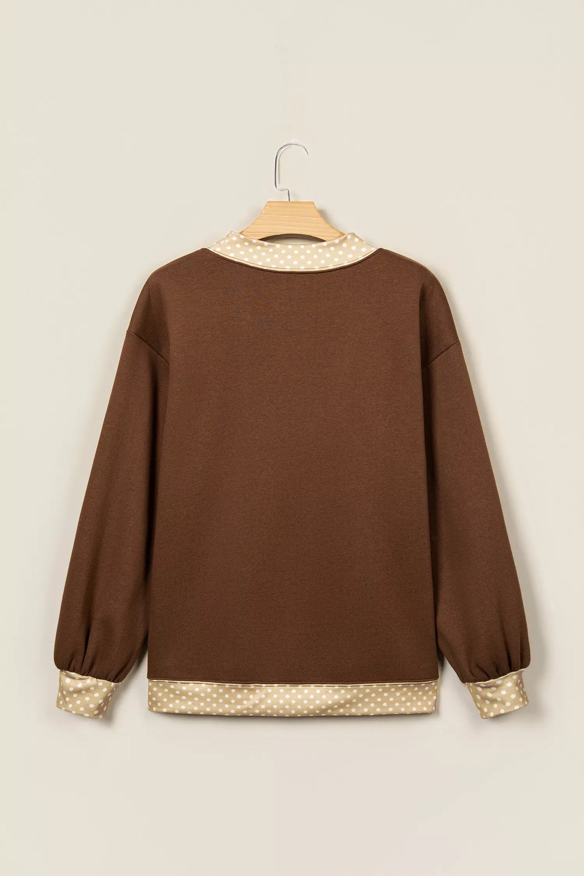 Dark brown crew sweatshirt with high neck and polka-dot trim at collar and cuffs