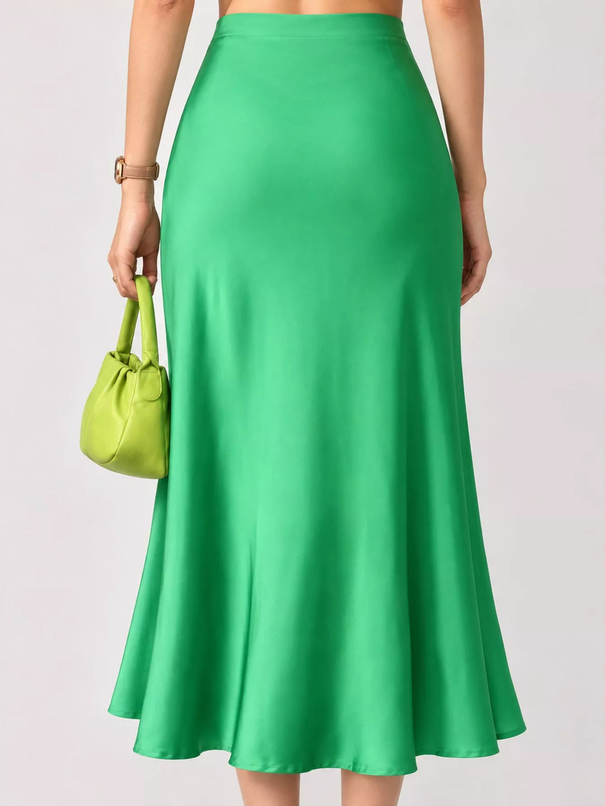 High-waisted satin midi skirt in green with gathered waist and flowing flare hem